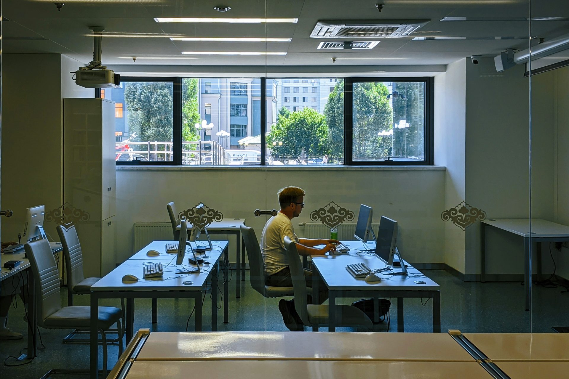 a man sitting at a desk in an office